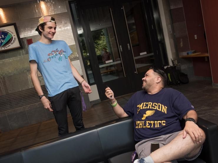 Two students share a laugh.